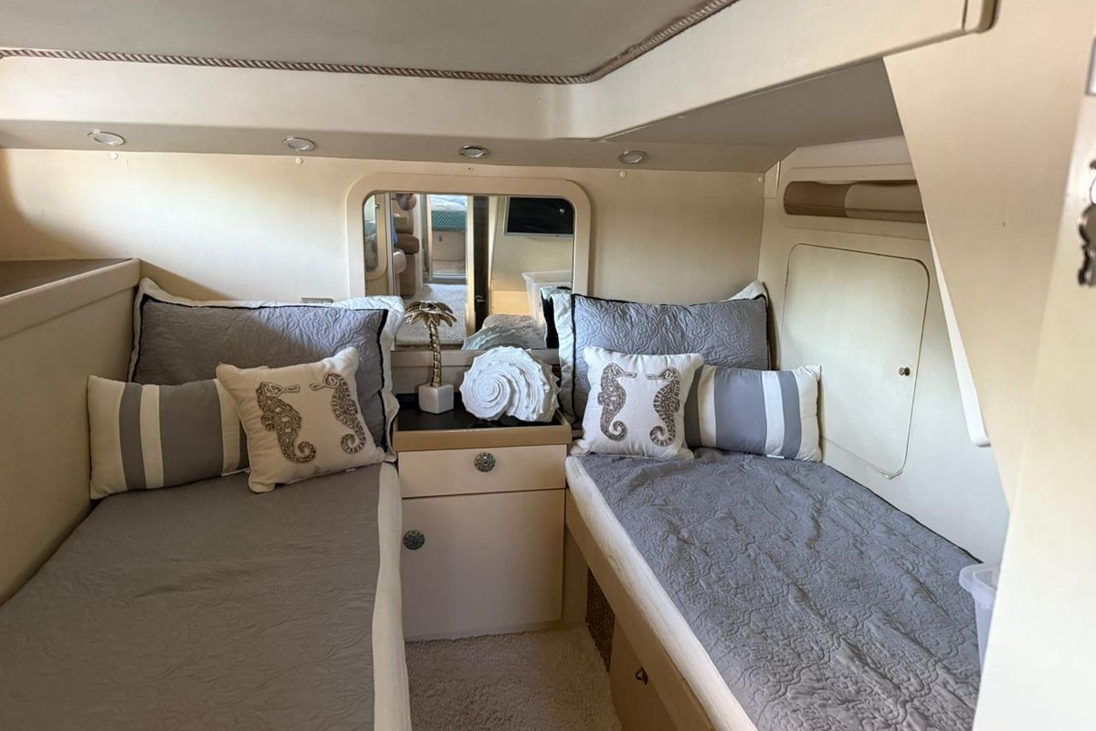 Private twin-bed guest cabin aboard a luxury yacht in Punta Cana featuring premium accommodations and modern amenities