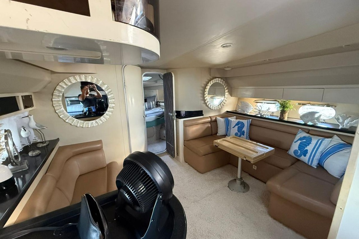Luxury yacht interior lounge with comfortable seating and elegant décor during a Punta Cana private yacht charter