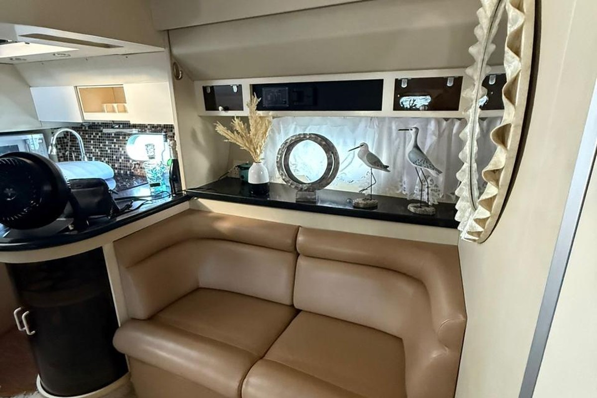 Panoramic view of a luxury yacht interior featuring lounge, seating area, and premium amenities in Punta Cana