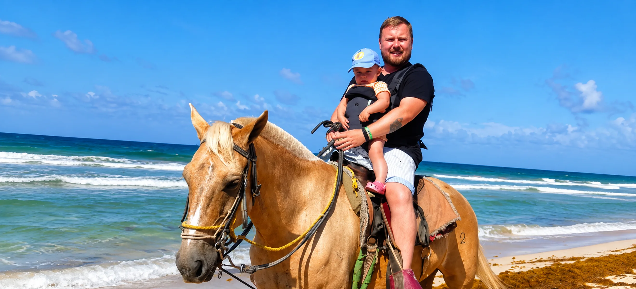	Remove 2		Father and young child enjoying a safe horseback riding experience along the beautiful beach in Punta Cana, Dominican Republic.