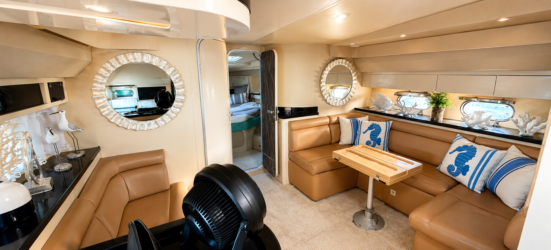 	Luxury yacht interior cabin in Punta Cana featuring a spacious lounge, premium leather seating, modern amenities, and elegant Caribbean-style décor