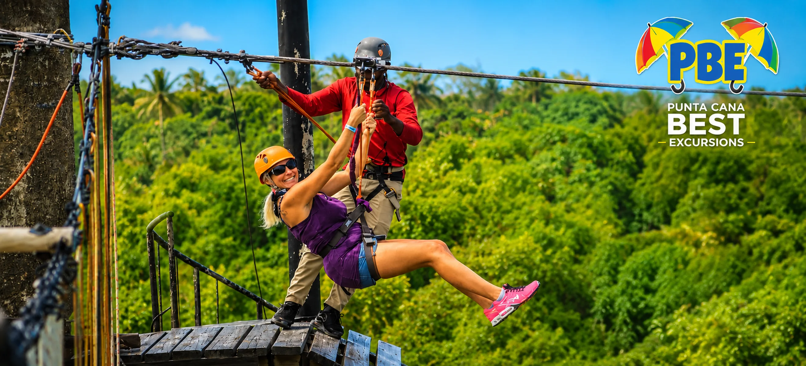 Guest launching on a zipline over the tropical rainforest during an adventure tour with Punta Cana Best Excursions in the Dominican Republic.