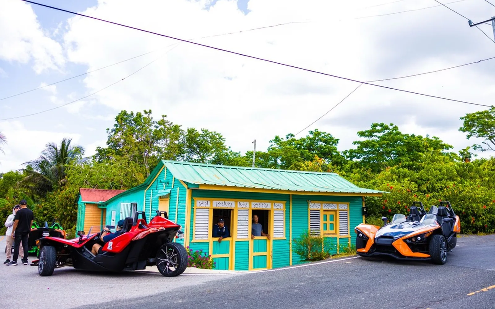 Polaris Slingshots outside a traditional Dominican cultural house near Nisibón