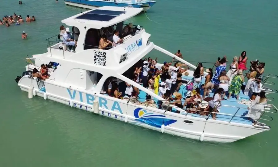 Vibra party boat with guests enjoying a catamaran celebration off Bavaro Beach in Punta Cana